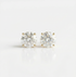 Pair of diamond stud earrings on a white background