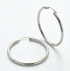Pair of white gold hoops on white background
